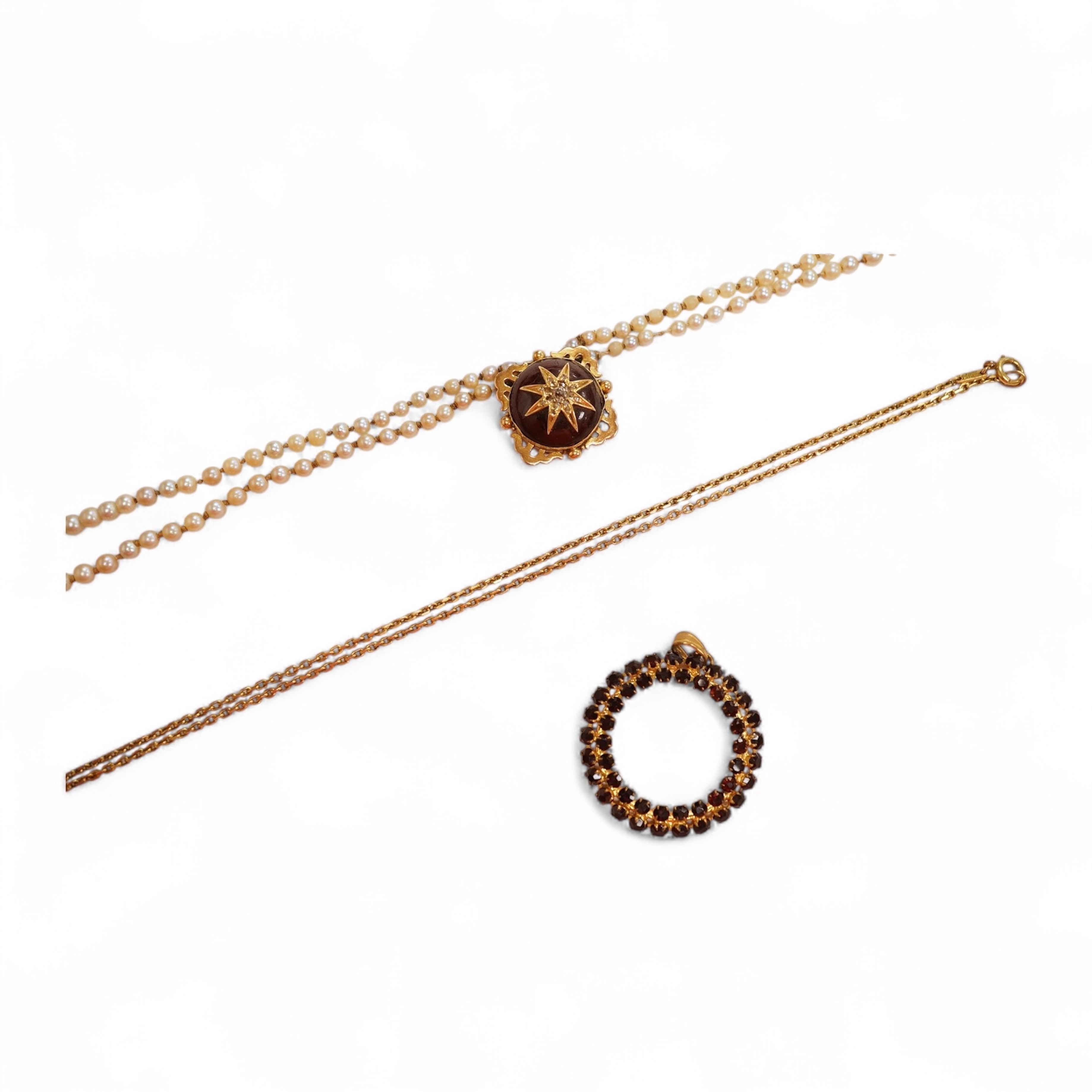 Two necklaces, comprising: a three-strand cultured pearl necklace, to a cabochon garnet and diamond clasp, length 34cm; and a paste and gilt metal pendant on a gold chain, chain length 44cm, stamped 14K, gross weight of